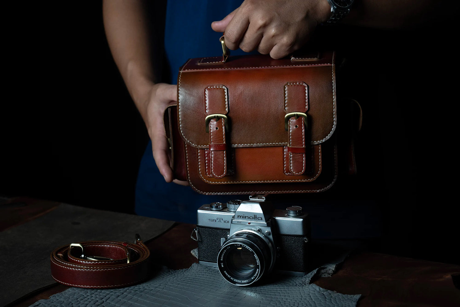 Photographer holding handmade leather camera bag – TDN Leather