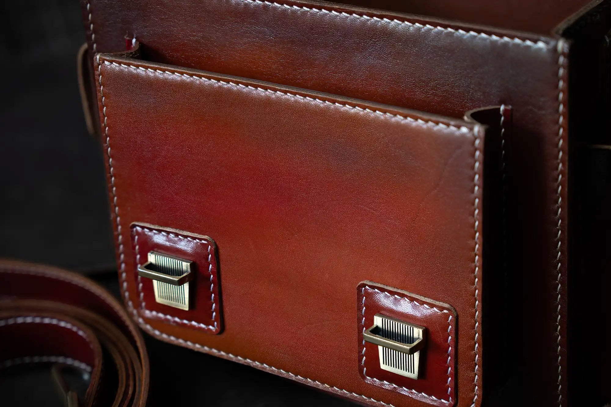 Close-up of hand stitching on handmade full-grain leather camera bag