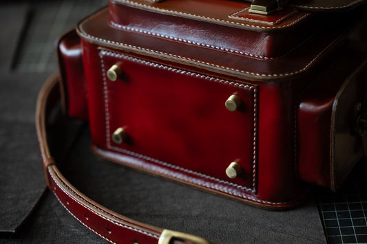 Sturdy bottom view of custom handmade leather camera bag – veg-tan leather
