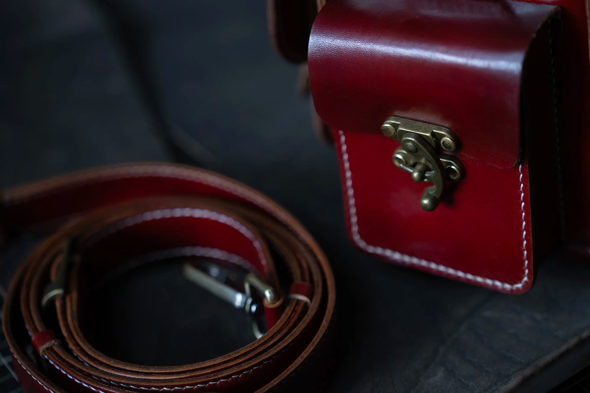 Detail of premium metal accessories on handcrafted leather camera bag